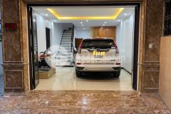 Bán nhà phố nguyễn khang,ô tô trong nhà.thang máy, phòng ngủ studio.dt65m2x6t